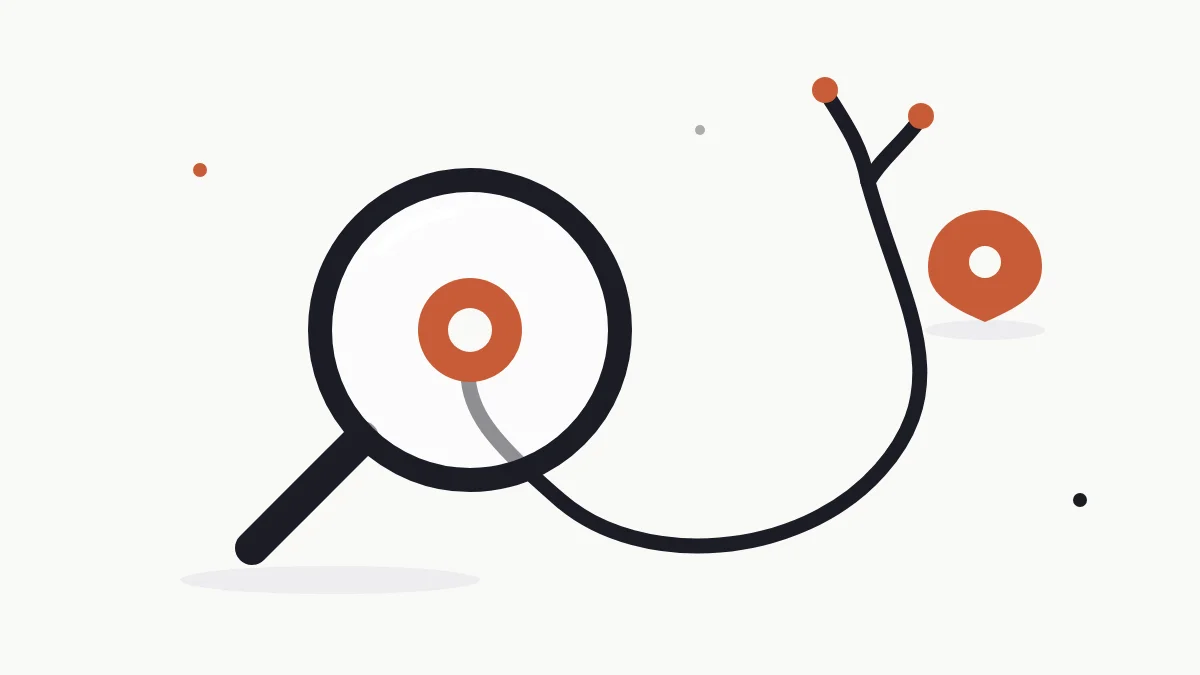 A flat illustration of a stethoscope curled beside a hand magnifying glass on a plain cream desk, with a small terracotta map pin between them