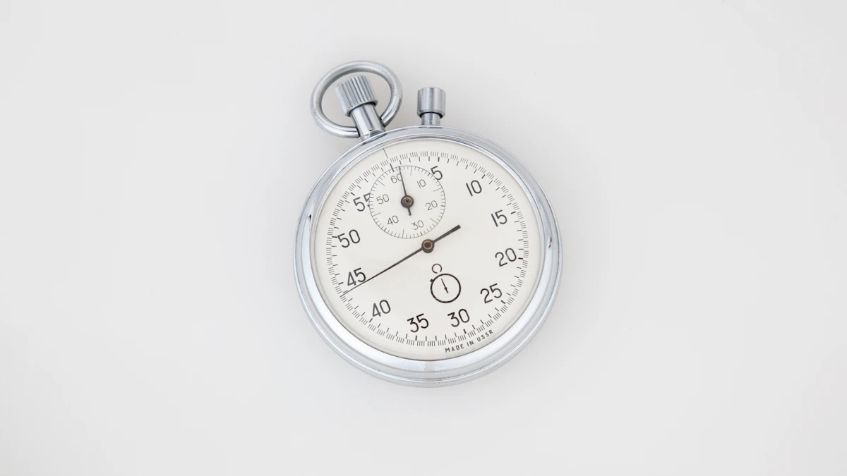 Laptop showing a landing page with a stopwatch next to it